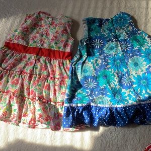 Two cute red, and blue floral dresses for a 3-4 years old girl